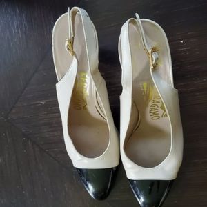 Ferragamo women shoes size  7- AA. Please see photos of mild scrat from storage